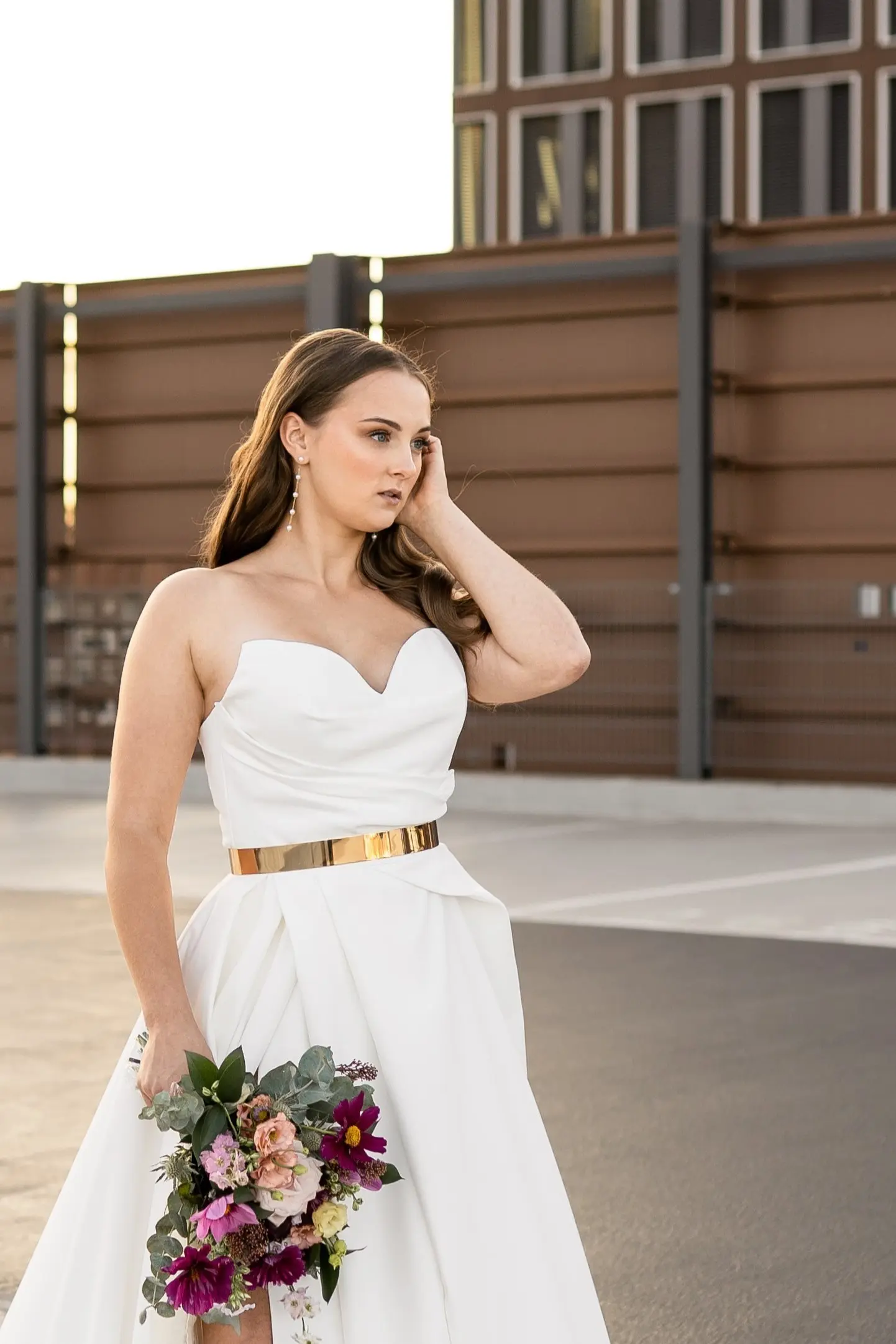 Celine <br>Foto: capturedbycari & kleinstadtfotografie<br>Kleid: ARIAMO via weddingmanufaktur<br>Floristik: margeritas floristik<br>Brautstyling: Judy R. Makeup